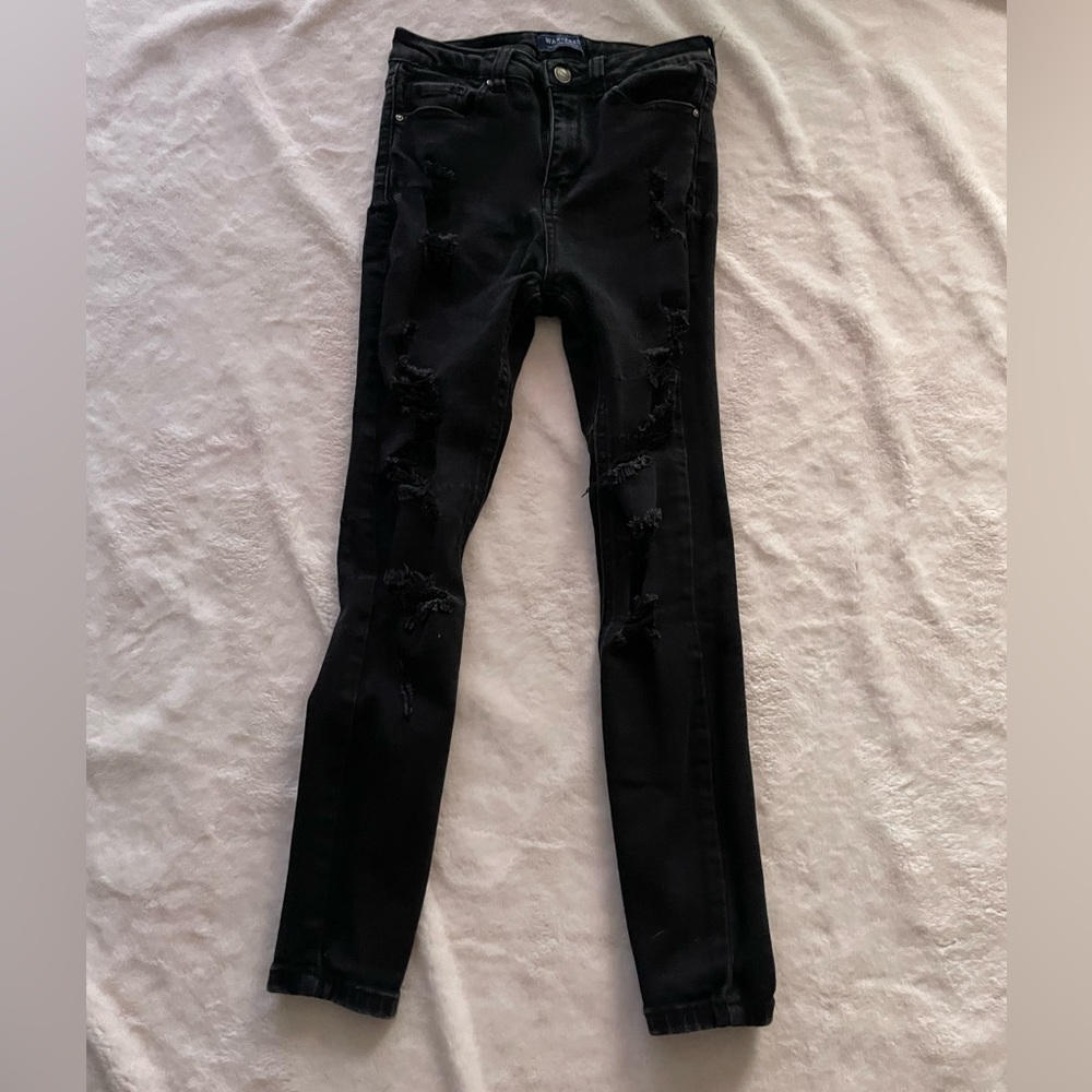 Women’s black ripped skinny jeans